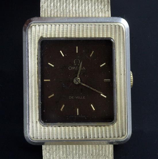 An Omega De Ville 14ct yellow gold and platinum wristwatch, 1970s, with stainless steel back.